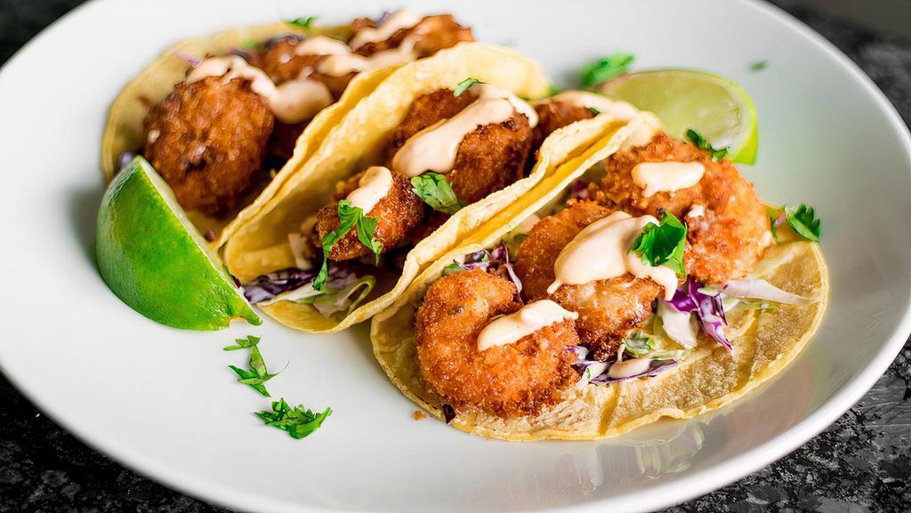Fried Shrimp Tacos · 2 fried shrimp tacos with a cabbage slaw, pico de gallo, and sour cream in a flour tortilla.