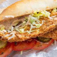 Fried Fish Po Boy · Fried fish, lettuce, tomato, pickles, and mayo on a french roll.