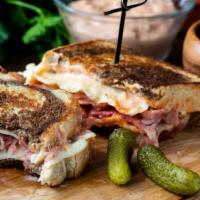 The Combo Panini · Grilled Panini Sandwich made with Pastrami, corned beef, provolone cheese, lettuce, tomato, ...