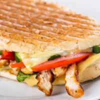 Chicken Fajita Panini · Grilled Panini Sandwich made with Grilled chicken, cheddar cheese, roasted peppers, carameli...