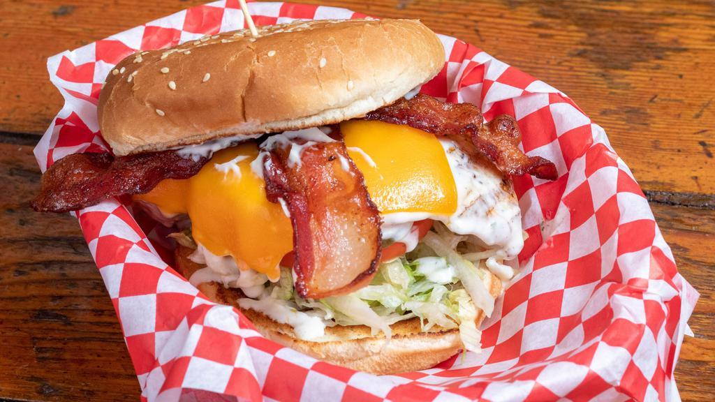 1254. Bacon Cheddar Chicken Sandwich · Topped with sliced Bacon, Melted Cheddar and Ranch Dressing. Add a side of fries, tots, onion rings or a salad for additional cost.