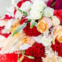 Exotic Romance · This floral arrangement is breathing with exotic and lush feelings. Red anthurium leaves pai...