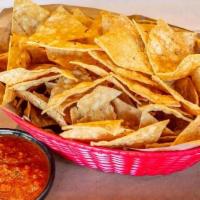 House-Made Chips And Salsa Roja · Our house-made tortilla chips with a side of salsa roja