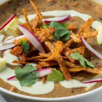 Chicken Tortilla Soup · Smoked chicken, tomatillo, pinto beans, avocado, crema