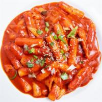 Spicy Rice Cake(떡볶이) · Ddokbokki. Rice cakes, fish cake, cabbage, and sesame in hot sauce. Extras egg, ramen, chees...