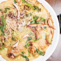 Scallion Pancake With Seafood(해물파전) · Crispy and chewy pancake with scallion, mixed seafood (squids, mussels, shrimps) and vegetab...