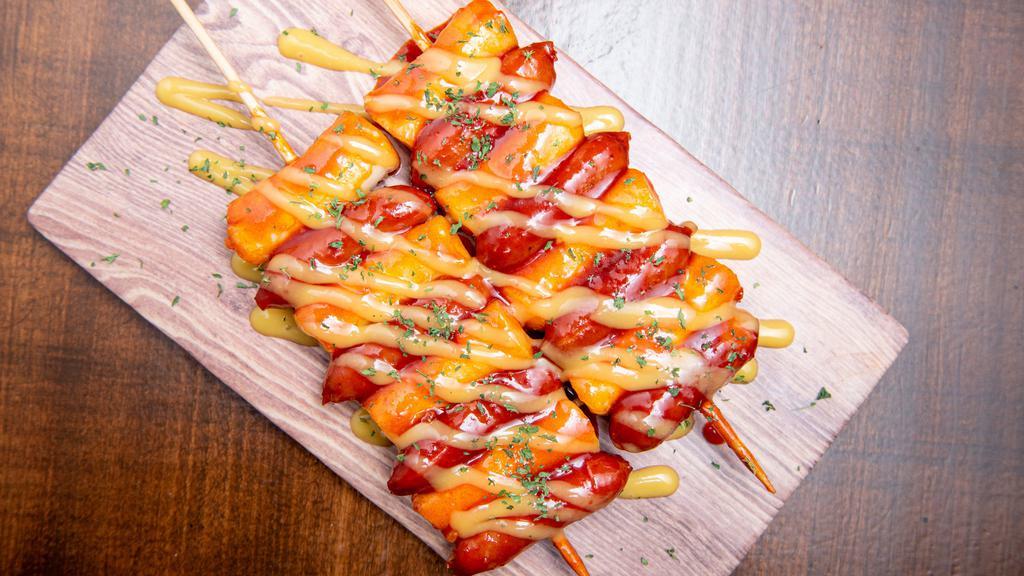 Rice Cake & Sausage Skewers(소떡) · Rice cake and sausage skewers with Korean sweet and spicy sauce.