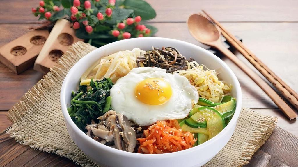 Bibimbap(비빔밥) · Vegetarian. White rice, medley of vegetables topped with a fried egg and miso soup.