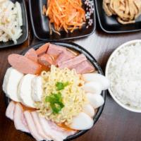 Army Stew(부대찌개) · Spicy. Budae Jjigae. Spicy stew with kimchi, tofu, spam, sausage, rice cakes , ramen noodles...