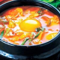 Seafood Soft Tofu Stew (해물순두부) · soft tofu stew with Seafood, vegetables, soft tofu and egg in spicy broth. Served with rice.