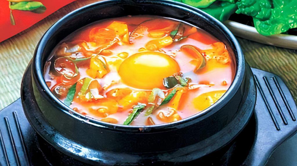 Seafood Soft Tofu Stew (해물순두부) · soft tofu stew with Seafood, vegetables, soft tofu and egg in spicy broth. Served with rice.