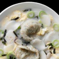 Rice Cake And Dumpling Soup(떡 만두국) · Dduk Man Du Kuk. Rice cakes, pork dumplings and egg in mild beef broth.