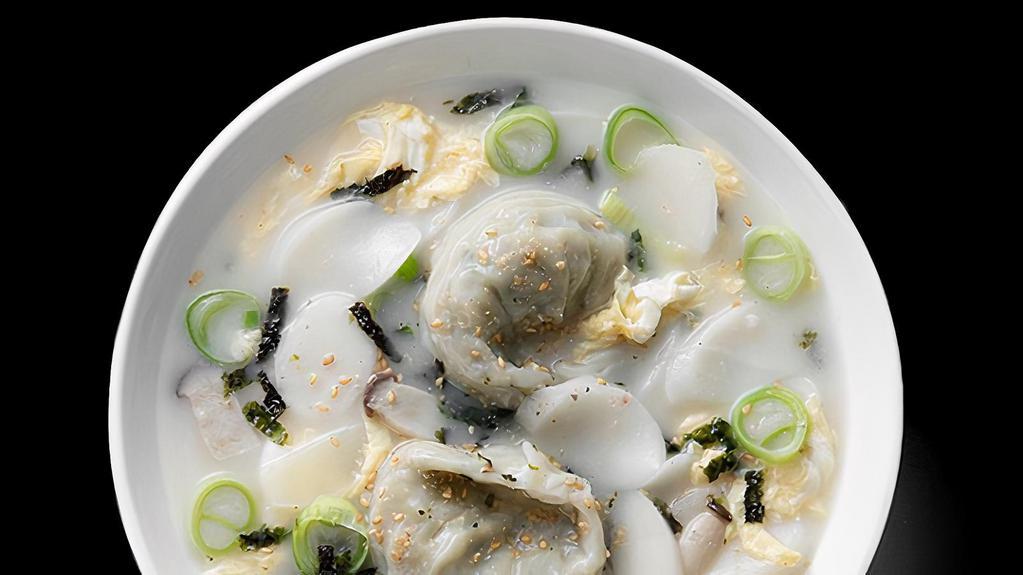 Rice Cake And Dumpling Soup(떡 만두국) · Dduk Man Du Kuk. Rice cakes, pork dumplings and egg in mild beef broth.