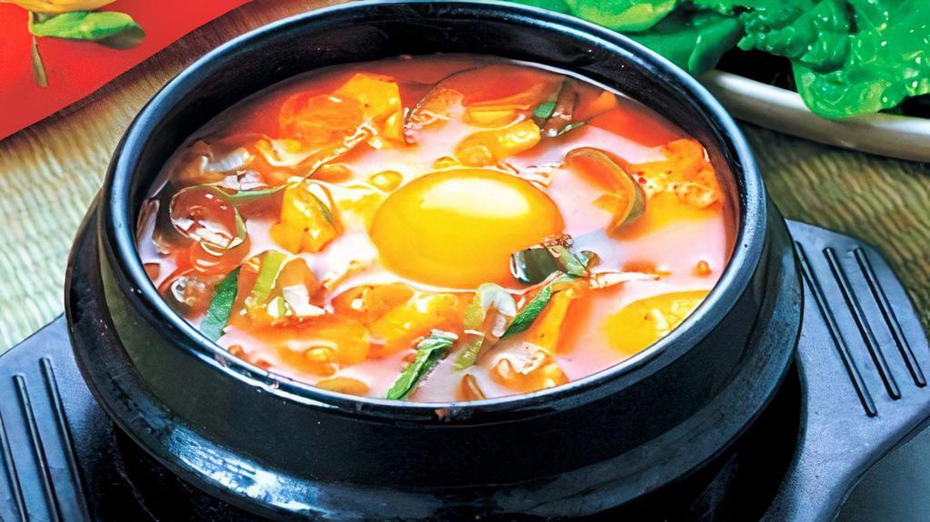 Kimchi Soft Tofu Stew (김치순두부) · Spicy. soft tofu stew with home made Kimchi, vegetables, soft tofu and egg in spicy broth. Served with rice.