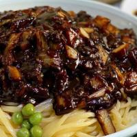Jja Jang Myeon (짜장면) · Freshly made udon noodles with pork and vegetables in black bean sauce.