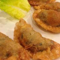 Mandu Gui · Pan fried dumplings made with meat and vegetables.