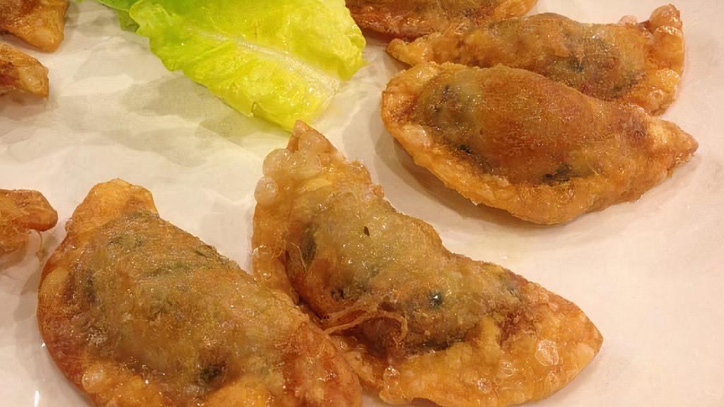 Mandu Gui · Pan fried dumplings made with meat and vegetables.
