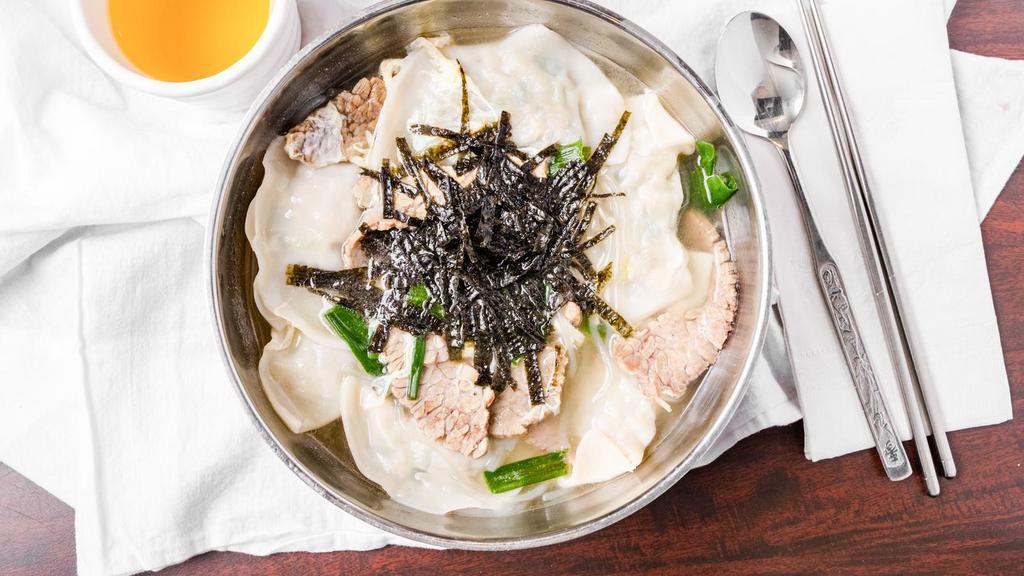 Duk Mandoo Gook · Traditional Korean soup consisting of both handmade dumplings and rice cakes.