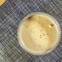 Tom Kha · Coconut milk-based soup with mushrooms & galangal.