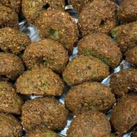 Falafel · Chickpeas patties mixed with spices and vegetables. Includes lettuce, tomatoes and sauce.