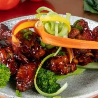 General Tso Fried Wings · Mild Heat. Steamed broccoli, candied orange.