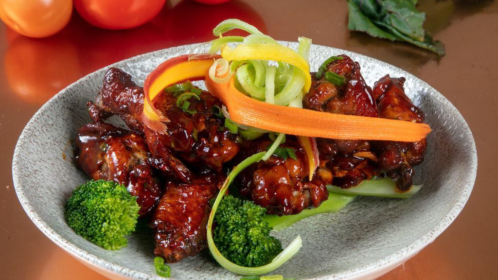 General Tso Fried Wings · Mild Heat. Steamed broccoli, candied orange.