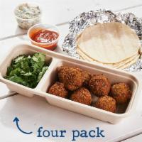 Falafel · (four or eight tacos per serving). herbed chickpea fritter served over a traditional greek-s...