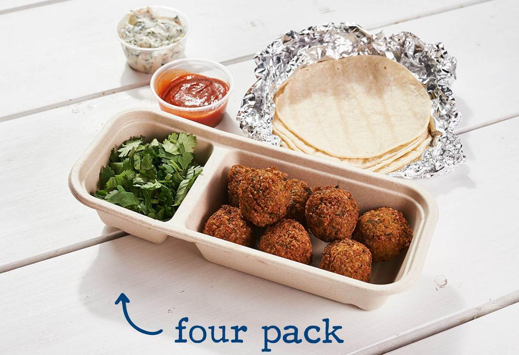 Falafel · (four or eight tacos per serving). herbed chickpea fritter served over a traditional greek-style tzatziki w/ sriracha . topped with: cilantro. contains: dairy, garlic, onion