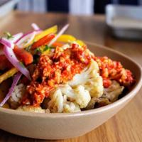 Cauliflower Bowl · roasted cauliflower topped with a romesco sauce. contains: garlic, nuts, onion