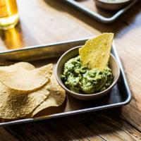 Guacamole + Chips · hand-mashed avocado, lime juice, serrano chiles, onions, and cilantro. contains: onion