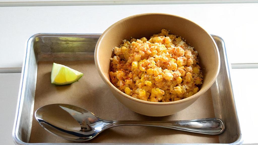 Esquites (Corn Off The Cob) · sweet corn kernels tossed with cotija cheese in a creamy and tangy mayonnaise sauce and topped with cayenne. contains: dairy, soy, eggs, refined sugar
