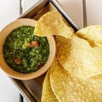 Salsa Verde + Chips · a spicy green salsa w/ charred veggies + tomatillos. contains: onion + refined sugar