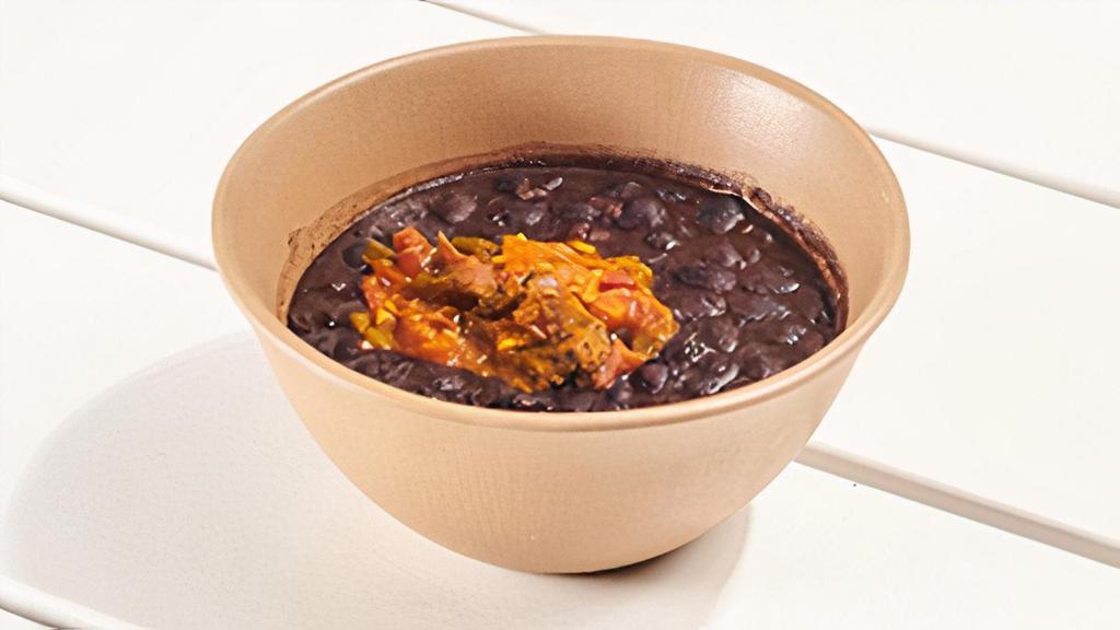 Black Beans W/ Sofrito · black beans stewed in a tomato, garlic, onion sofrito. contains: garlic + onion