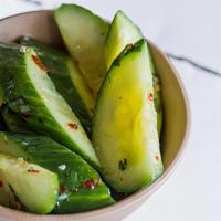 Spicy Cucumber Salad · cucumbers tossed in garlic, red pepper flakes, cilantro and rice wine vinegar. contains: gar...