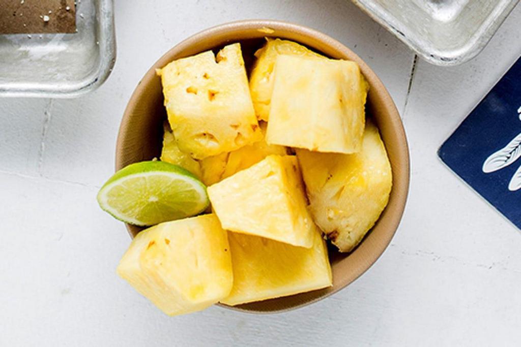 Fresh Pineapple · served with a wedge of lime