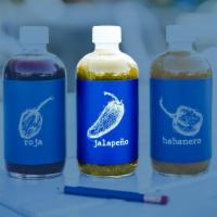 Jalapeno Hot Sauce Bottle · spirited jalapeno enhanced with garlic and bay