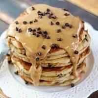 Peanut Butter Chocolate Chip Pannies · 2 chocolate chip pancakes served with maple syrup, chocolate chips, peanut butter, butter, a...