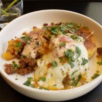 Mexican Chorizo Scramble · All fried eggs are cooked with a runny yolk. Cornbread, Charred Pineapple Salsa, Chipotle Cr...