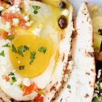 Breakfast Tacos · Three corn tortillas, eggs, bacon, sausage, beans.