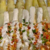 French White Asparagus  W/ Lobster · chilled white asparagus, chunks of fresh Maine lobster, vegetable vinaigrette