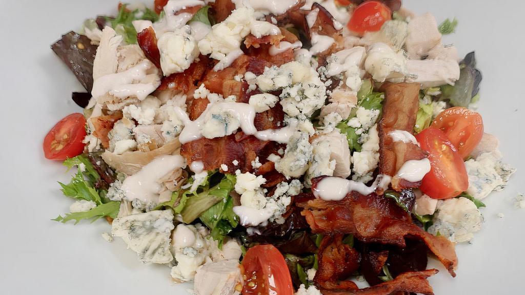 Club Salad  · Freshly-roasted turkey, applewood smoked bacon, tomato,
onion, blue cheese on mixed greens with bistro dressing