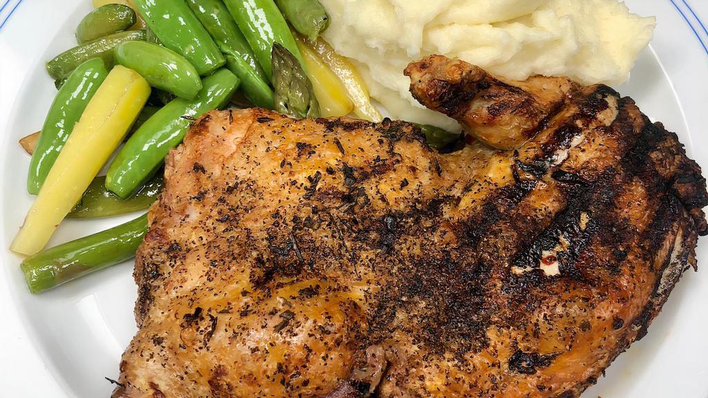 Pollo Alla Mattone · Pounded bone-in chicken roasted with fresh herbs, lemon, crushed red pepper, spring vegetables, mashed potatoes