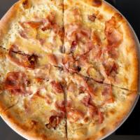 Pizza “Tart Flambe” · A white pizza with ham, bacon & Appenzeller cheese