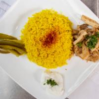Chicken Shawerma Over Rice · Grill chicken shawerma over our homemade basmati rice and topped with your choice of tahani ...