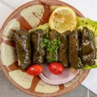Dolma (7 Pieces) · A seasoned mixture of rice, parsley, chopped onions, tomatoes, fine herbs tolled in steamed ...