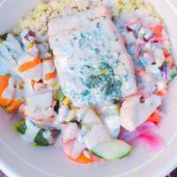Roasted Salmon Bowl · Herb marinated, roasted salmon served over quinoa with Israeli salad, roasted veggies and Fo...