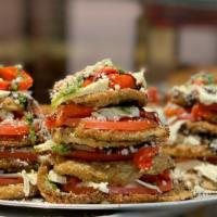 Eggplant Tower · Breaded eggplant, fresh tomato, roasted peppers and fresh mozzarella piled high topped with ...
