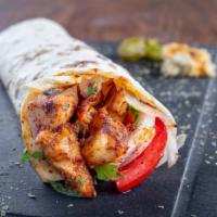 Sicilian Wrap · Wrap with grilled chicken, peppers and onions. Served with a pickle and chips.