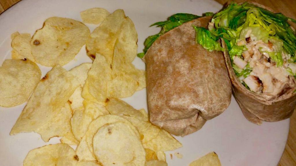 Grilled Chicken Caesar Sicilian Wrap · Grilled chicken, roasted red peppers, sun-dried tomatoes, grilled eggplant, lettuces and pesto mayo. Served with potato chips.