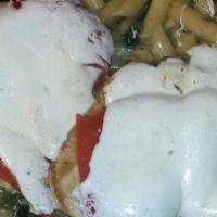 Chicken Cardinal · Spinach, roasted peppers, fresh mozzarella in brown gravy sauce. Served with pasta and bread.